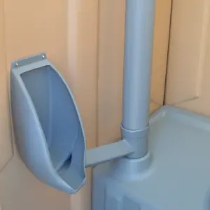 Double towable restroom trailer with two tan portable toilets in Rancho Cordova, CA 